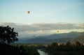 Colorful hot-air balloons flying over the mountain Royalty Free Stock Photo