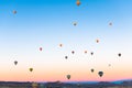Colorful hot air balloons flying over the mountains in Cappadocia, Turkey Royalty Free Stock Photo
