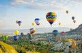 Colorful hot air balloons flying over Red valley at Cappadocia Royalty Free Stock Photo