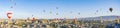 Colorful hot air balloons flying over rock landscape at Cappadocia Turkey