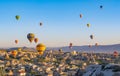 Colorful hot air balloons flying over rock landscape at Cappadocia Turkey Royalty Free Stock Photo