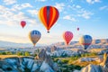 Colorful hot air balloons flying over rock landscape at Cappadocia Turkey Royalty Free Stock Photo