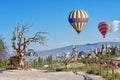 Hot air balloons over rural landscape, in Cappadocia, Turkey Royalty Free Stock Photo