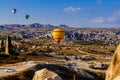 Colorful hot air balloons flying over the valley at Cappadocia, Anatolia, Turkey. Royalty Free Stock Photo