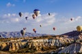 Colorful hot air balloons flying over the valley at Cappadocia, Anatolia, Turkey. Royalty Free Stock Photo