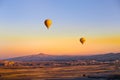 Colorful hot air balloons flying over the valley Royalty Free Stock Photo