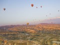 Colorful hot air balloons flying over the valley at Cappadocia, Anatolia, Turkey. Volcanic mountains in Goreme national park. Royalty Free Stock Photo