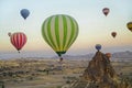 Colorful hot air balloons flying over the valley