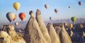 Colorful hot air balloons flying over valley at Cappadocia Royalty Free Stock Photo