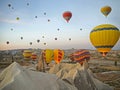 Colorful hot air balloons flying over the valley at Cappadocia