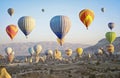 Colorful hot air balloons flying over the valley at Cappadocia Royalty Free Stock Photo