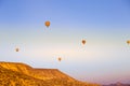 Colorful hot air balloons flying over the valley Royalty Free Stock Photo