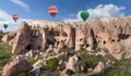 Colorful hot air balloons flying over Zelve valley, Turkey Royalty Free Stock Photo