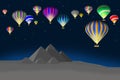 Colorful hot air balloons over scenic pyramids Royalty Free Stock Photo