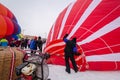 Colorful hot air balloons prepare to launch at a balloon festival