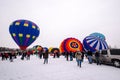 Colorful hot air balloons prepare to launch at the Hudson Hot Ai