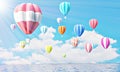 Colorful hot air balloons rising above serene the ocean seascape with blue sky background. Beautiful sun light Hot air balloon