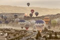Colorful hot air balloons take flight over the city of goreme at sunrise Royalty Free Stock Photo