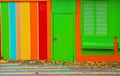 Colorful house. Bright colorful wall facade with green door and Royalty Free Stock Photo