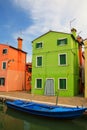 Colorful house by canal in Burano, Venice, Italy. Royalty Free Stock Photo