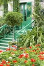 Colorful house entrance with flowers covering front side