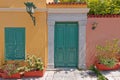 Colorful house exterior green door and windows with flowerpots, Plaka old neighborhood, Athens Greece Royalty Free Stock Photo