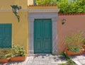 Colorful house facade with green door and window Royalty Free Stock Photo