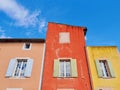 Colorful house facade in scenic Luberon village Roussillon in Provence, France Royalty Free Stock Photo