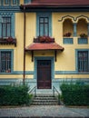 Colorful house facade, vintage style with retro porch and awning. Traditional european building exterior, front view at entrance Royalty Free Stock Photo