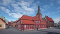 House facades with church and street in Ystad in Sweden