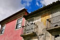 Colorful house facades in old town of Porto, black birds sitting on balcony railing. Portugal Royalty Free Stock Photo