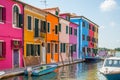 Colorful houses along a canal on Burano island Italy