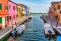 Colorful houses along the water canal in the island of Burano, Venice Royalty Free Stock Photo
