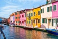 Colorful houses along the water canal in the island of Burano, Venice Royalty Free Stock Photo