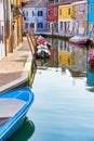 Colorful houses along the water canal in the island of Burano, Venice Royalty Free Stock Photo