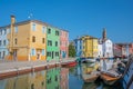 Colorful houses along a canal on Burano island Italy