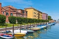 Colorful houses and boats at sunny day, Venice, Italy.