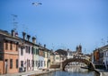 Colorful houses, bridge and canal in Comacchio, Emilia Romagna, Italy