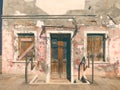 Colorful houses of Burano Island. Venice. Typical street with hanging laundry at facades of colorful houses