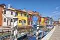 Colorful houses and canal on Burano island, near Venice, Italy.