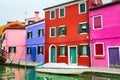 Colorful houses on the canal in Burano island, Venice, Italy Royalty Free Stock Photo