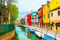 Colorful houses on the canal in Burano island, Venice, Italy Royalty Free Stock Photo