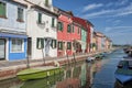 Colorful houses and canal on Burano island, Venice, Italy.