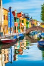 Colorful houses on the canal in Burano island, Venice, Italy Royalty Free Stock Photo