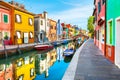 Colorful houses on the canal in Burano island, Venice, Italy Royalty Free Stock Photo