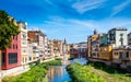 Colorful houses and Eiffel bridge over Onya river in Girona, Spain Royalty Free Stock Photo