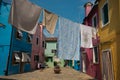 Colorful houses and hanging clothes in the center of Burano Royalty Free Stock Photo