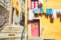 Colorful houses in a narrow street with hanging laundry, Ribeira district, Porto, Portugal Royalty Free Stock Photo