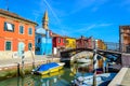 Colorful houses near canal on Burano island, Venice, Italy Royalty Free Stock Photo