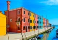 Colorful houses near canal on Burano island, Venice, Italy Royalty Free Stock Photo